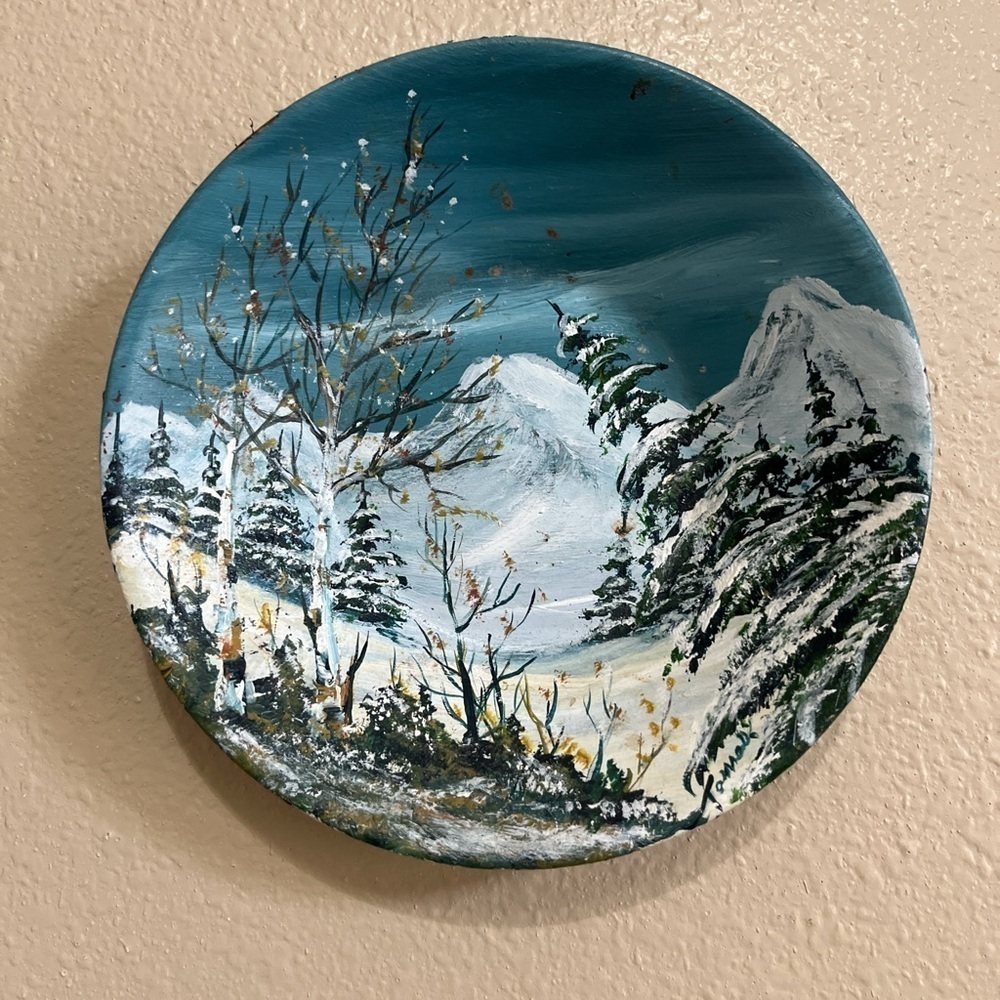 Hand painted signed winter snow mountain scene on a round metal plate!